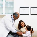 Image of a doctor talking to a child