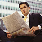 Image of man reading the news
